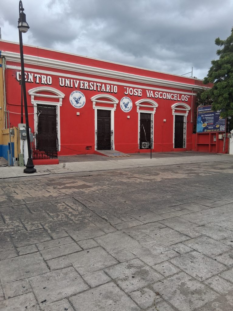 A beautiful red colonial building in Mérida with traditional architecture